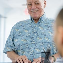 Key Largo Dental Associates - A friendly moment with a patient at our reception desk.