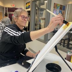 Painting With a Twist - Diane working on her masterpiece