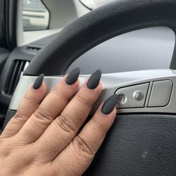 Indy Nails - Black matte stiletto nails.