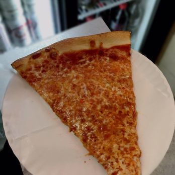 Amore Pizzeria - A slice of CHEESE PIZZA. It was very good, but nothing special. A tad greasy. However, this is definitely an authentic New Yawk pizzeria! - Pizza Near Me - Flushing, New York