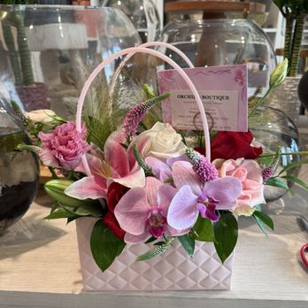 Orchid Boutique Florist - Orchids in a purse, "pretty lady" is the name on DoorDash - Flowers & Gifts Near Me - San Gabriel, California Orchid Boutique Florist - Orchids in a purse, "pretty lady" is the name on DoorDash - Flowers & Gifts Near Me - San Gabriel, California