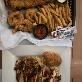 Caribbean Jack's - Combo basket with fish and shrimp, and jerk chicken pasta - Caribbean Near Me - Daytona Beach, Florida