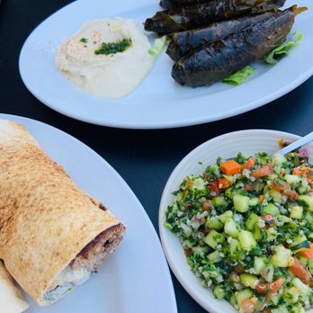 Jerusalem Garden - Kibbeh Ball Sandwich (left), Tabbouli (right), Veggie Grape Leaves Sampler (top) and hummus - Desserts Near Me - Ann Arbor, Michigan Jerusalem Garden - Kibbeh Ball Sandwich (left), Tabbouli (right), Veggie Grape Leaves Sampler (top) and hummus - Desserts Near Me - Ann Arbor, Michigan