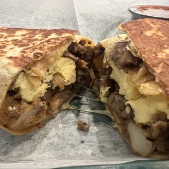 Bakery Mill & Deli - Breakfast burrito with sausage, chipotle gouda, add mushrooms and onions - Bakeries Near Me - Gainesville, Florida Bakery Mill & Deli - Breakfast burrito with sausage, chipotle gouda, add mushrooms and onions - Bakeries Near Me - Gainesville, Florida