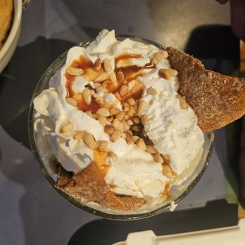 Gabriel's - Ice cream sundae with cinnamon sugar chips, caramel sauce, and piñon (pine nuts) - Mexican Near Me - Santa Fe, New Mexico