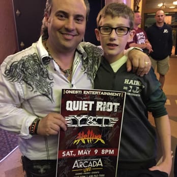 Arcada Theatre - Mr. Onesti and one happy little rocker! - Performing Arts Near Me - St. Charles, Illinois Arcada Theatre - Mr. Onesti and one happy little rocker! - Performing Arts Near Me - St. Charles, Illinois