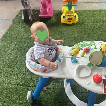 Bilingual Garden Daycare - My son playing in the outdoor play area - Child Care & Day Care Near Me Bilingual Garden Daycare - My son playing in the outdoor play area - Child Care & Day Care Near Me