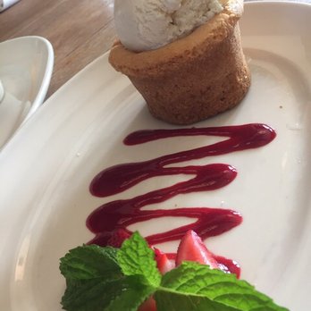 Coastal Kitchen - Butter cream cake with vanilla ice cream and raspberry sauce - New American Near Me - Dana Point, California