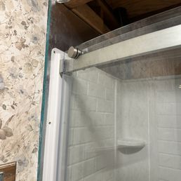 Didn't install shower properly so they had to add a thick piece of plywood making the shower wall stick way out from the main wall. Didn't install shower properly so they had to add a thick piece of plywood making the shower wall stick way out from the main wall.