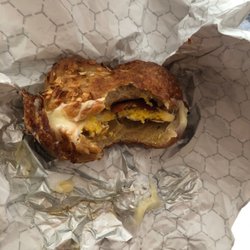 Almolus - Bacon egg and cheddar cheese on onion bagel