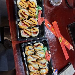 two trays of sushi two trays of sushi