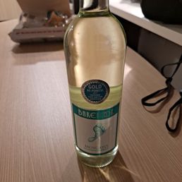 a bottle of wine on a table a bottle of wine on a table