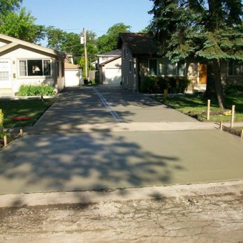 Gray Slate Hardscapes - a driveway with a concrete slab - Landscaping Near Me