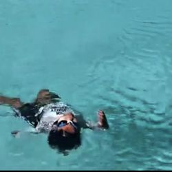 Dolphin Swimming Club - Max floating on the back