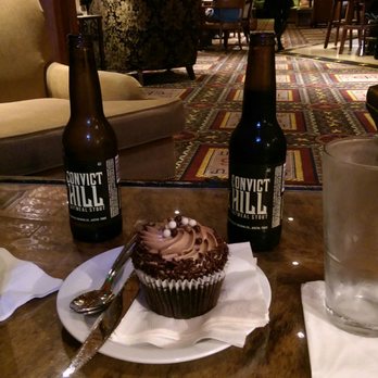The Driskill Bar - Local craft oatmeal stout beer paired perfectly with chocolate cupcake deliciousness - Lounges Near Me - Austin, Texas The Driskill Bar - Local craft oatmeal stout beer paired perfectly with chocolate cupcake deliciousness - Lounges Near Me - Austin, Texas
