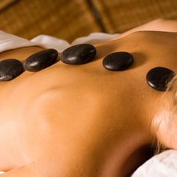 Let Hot Stone Therapy melt your muscle tension at Centered Natural Healing.