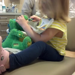 Burstein Robert N DDS - Sarah brushing Gar's teeth