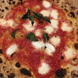margherita pizza - a huge disappointment, not very good, and expensive. margherita pizza - a huge disappointment, not very good, and expensive.