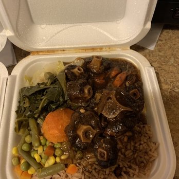 Caribbean Authentic Cuisine - Oxtail with rice and beans green's cabbage and mixed vegetables - Caribbean Near Me - Sterling Heights, Michigan Caribbean Authentic Cuisine - Oxtail with rice and beans green's cabbage and mixed vegetables - Caribbean Near Me - Sterling Heights, Michigan
