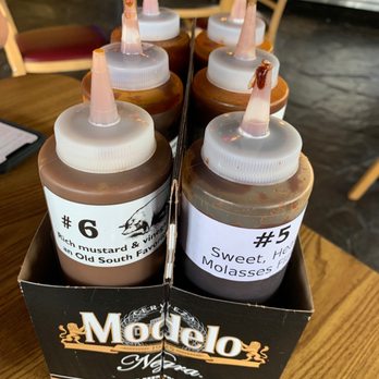 Whole Hog Cafe - Great way to serve sauces. Love the labels. - Barbeque Near Me - Santa Fe, New Mexico