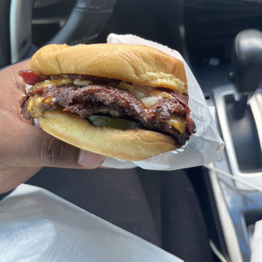 Burger Bodega - Double meat burger w/ bacon, onions and pickles - Burgers Near Me - Houston, Texas