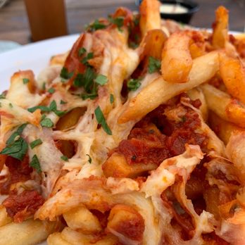 Stag Bar + Kitchen - Poutine Pizza - Pizza Near Me - Newport Beach, California Stag Bar + Kitchen - Poutine Pizza - Pizza Near Me - Newport Beach, California