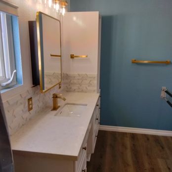 Martinez Construction - Waterproof vinyl flooring accessories countertop and sink all accessible for customer on wheelchair for easy access. - Damage Restoration Near Me