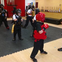 Tiger Kids (7-10 year old) learning techniques with each other in a safe and fun environment.