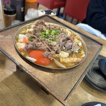 Tasty Pot - My friend ordered beef soup, but I think it's beef seafood soup - Hot Pot Near Me - Concord, California