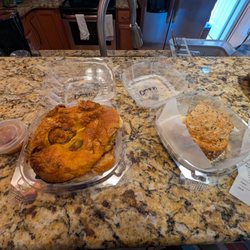 Union Market - Togo box of jalapeno cheese bagel with fried egg and country sausage on left. Half egg on wheat on right side.