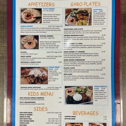 Zorbas Gyros Burgers And More - Zorba's Menu Side 1 - 01/26/26. Sorry, "Greek Nachos with Gyro" is obscured by glare.