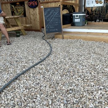 Tasty Thai - Kuna - a gravel patio with a chalkboard sign - Thai Near Me - Kuna, Idaho Tasty Thai - Kuna - a gravel patio with a chalkboard sign - Thai Near Me - Kuna, Idaho