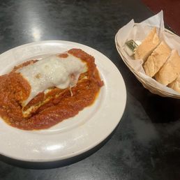 Lasagna - Meat Sauce, and Mozzarella. Four Slices Of Bread.