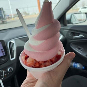 Super Churro Split - a hand holding a cup of ice cream - Ice Cream & Frozen Yogurt Near Me - El Paso, Texas