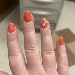 Paradise Nails & Spa - Middle finger nails is not straight at all.