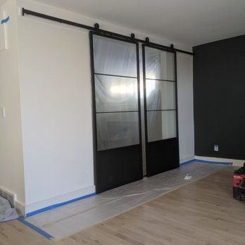 Azimuth Works - an empty room with a sliding door - General Contractors Near Me - Seattle, Washington