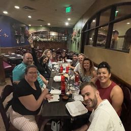 Group enjoying a delicious meal Group enjoying a delicious meal