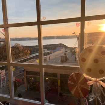 Sweetie's Candy - a view of a sunset through a window - Candy Stores Near Me - Seattle, Washington Sweetie's Candy - a view of a sunset through a window - Candy Stores Near Me - Seattle, Washington