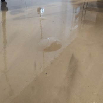 Stabil-Loc - a puddle of water on the floor - Waterproofing Near Me - Owensboro, Kentucky