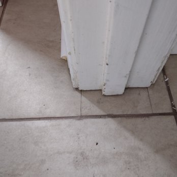 Floors Outlet - If tiles broke while cutting with a 4 inch handsaw, Caleb installed the broken pieces next to one another to make a tile. - Flooring Near Me - Statesboro, Georgia