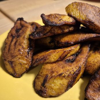 Jamaican Jerk Pit - 2026-08-26. Jamaican Jerk Pit. Ann Arbor, MI. Fried plantains (close up.) - Caribbean Near Me - Ann Arbor, Michigan Jamaican Jerk Pit - 2026-08-26. Jamaican Jerk Pit. Ann Arbor, MI. Fried plantains (close up.) - Caribbean Near Me - Ann Arbor, Michigan