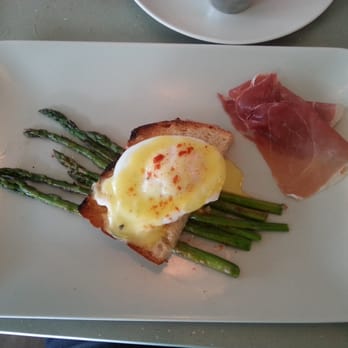 The Strand - Asparagus with a sunny side down egg lovingly glazed with hollandaise and prosciutto. It was delicious. I recommend it! - New American Near Me - Orlando, Florida The Strand - Asparagus with a sunny side down egg lovingly glazed with hollandaise and prosciutto. It was delicious. I recommend it! - New American Near Me - Orlando, Florida