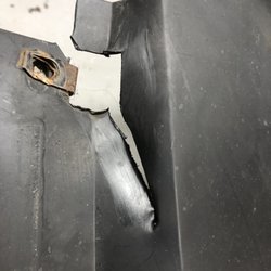 Smith's Rollback Service - Tow hook damage to lower radiator shroud. Smith Towing damage