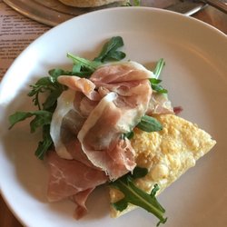 Decker Kitchen - Prosciutto and Arugula Parmesan crust almost like a pastry so crispy and fluffy!