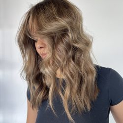 Evolve Hair Design - Honey blonde highlights and a layered haircut with face framing pieces