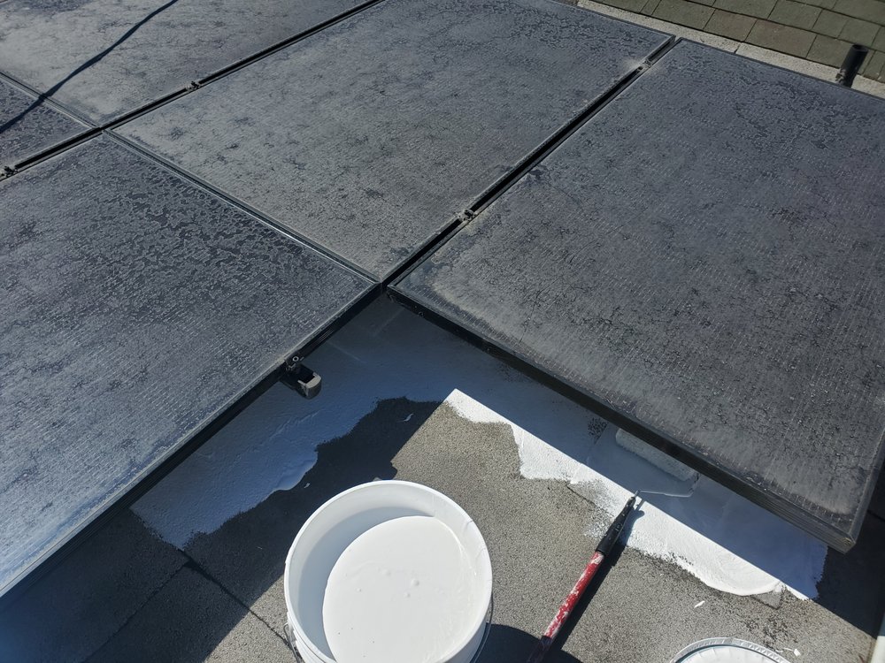 Slide of Mikes Roofing