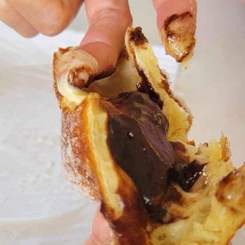 Leonard's Bakery - Undercooked center of Dobash malasada - Bakeries Near Me - Waipahu, Hawaii