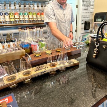 30A Distilling Co - a bartender at a bar - Distilleries Near Me - Santa Rosa Beach, Florida 30A Distilling Co - a bartender at a bar - Distilleries Near Me - Santa Rosa Beach, Florida