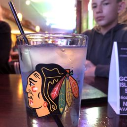 a glass of water with a blackhawks logo a glass of water with a blackhawks logo