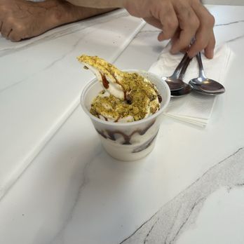 Hamsa - This is the rose flavored soft serve topped with a pomegranate molasses & crushed pistachio's...a MUST try! - Arabic Near Me - Seattle, Washington Hamsa - This is the rose flavored soft serve topped with a pomegranate molasses & crushed pistachio's...a MUST try! - Arabic Near Me - Seattle, Washington